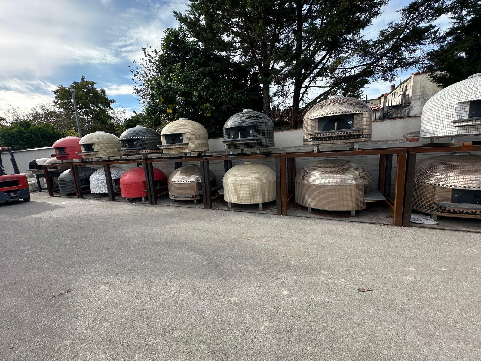 Vesuviano wood-fired pizza ovens lined up in our Naples workshop
